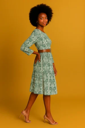 Elegant green floral midi dress with long sleeves and a cinched belt—lightweight, modest, and perfect for work, church, or weekend events.